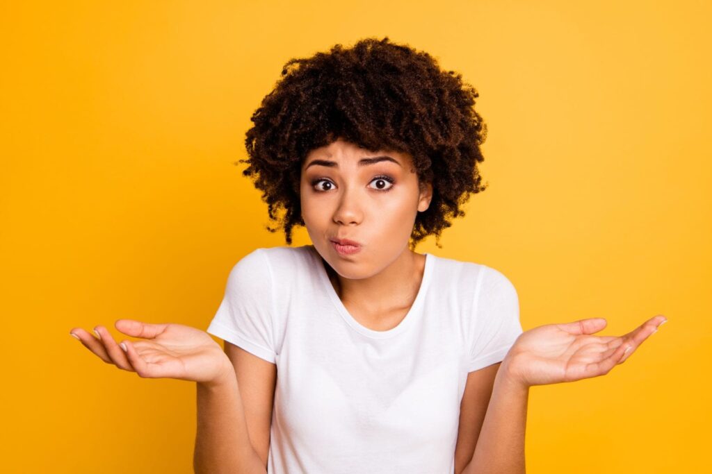 Does Your AC Need Repairs or Replacement? woman who does not know the answer