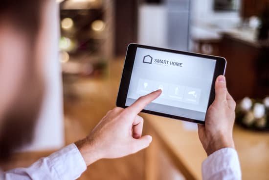 person using thermostat app on smart pad