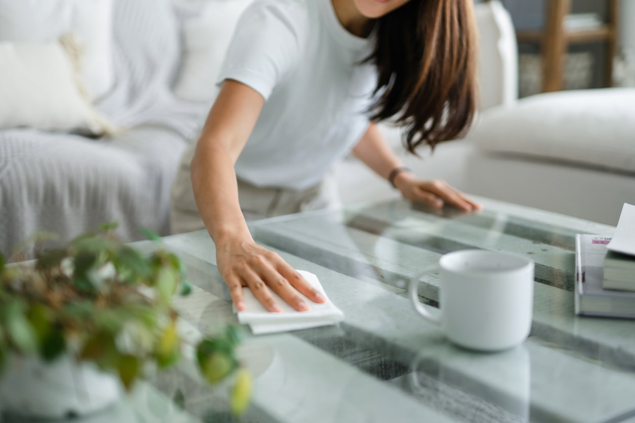 wiping up a mess on the kitchen counter